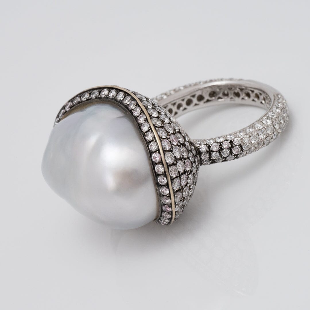 Assael Collection: 22.2 x 18.1 x 17.0 mm Baroque White South Sea Pearl and Diamond Ring featuring a large baroque white South Sea pearl surrounded by pavé-set diamonds on a white gold band.