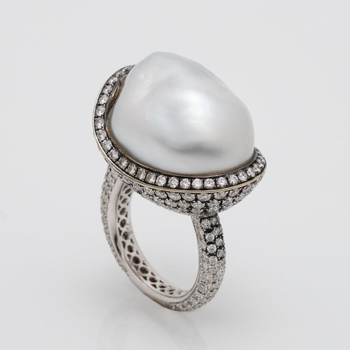 Assael Collection: 22.2 x 18.1 x 17.0 mm Baroque White South Sea Pearl and Diamond Ring featuring a large baroque white pearl accented by a pavé diamond halo and band in exquisite fine jewelry design.