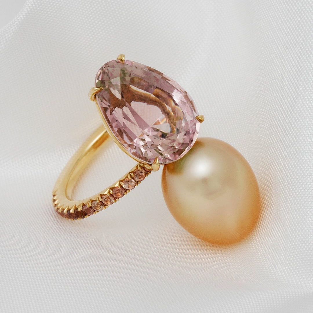 Assael Collection: 10.9x14.2 mm Golden South Sea Pearl, Tourmaline & Yellow Sapphire Ring featuring a large golden pearl and pear-shaped pink tourmaline set in a gold band with yellow sapphires.