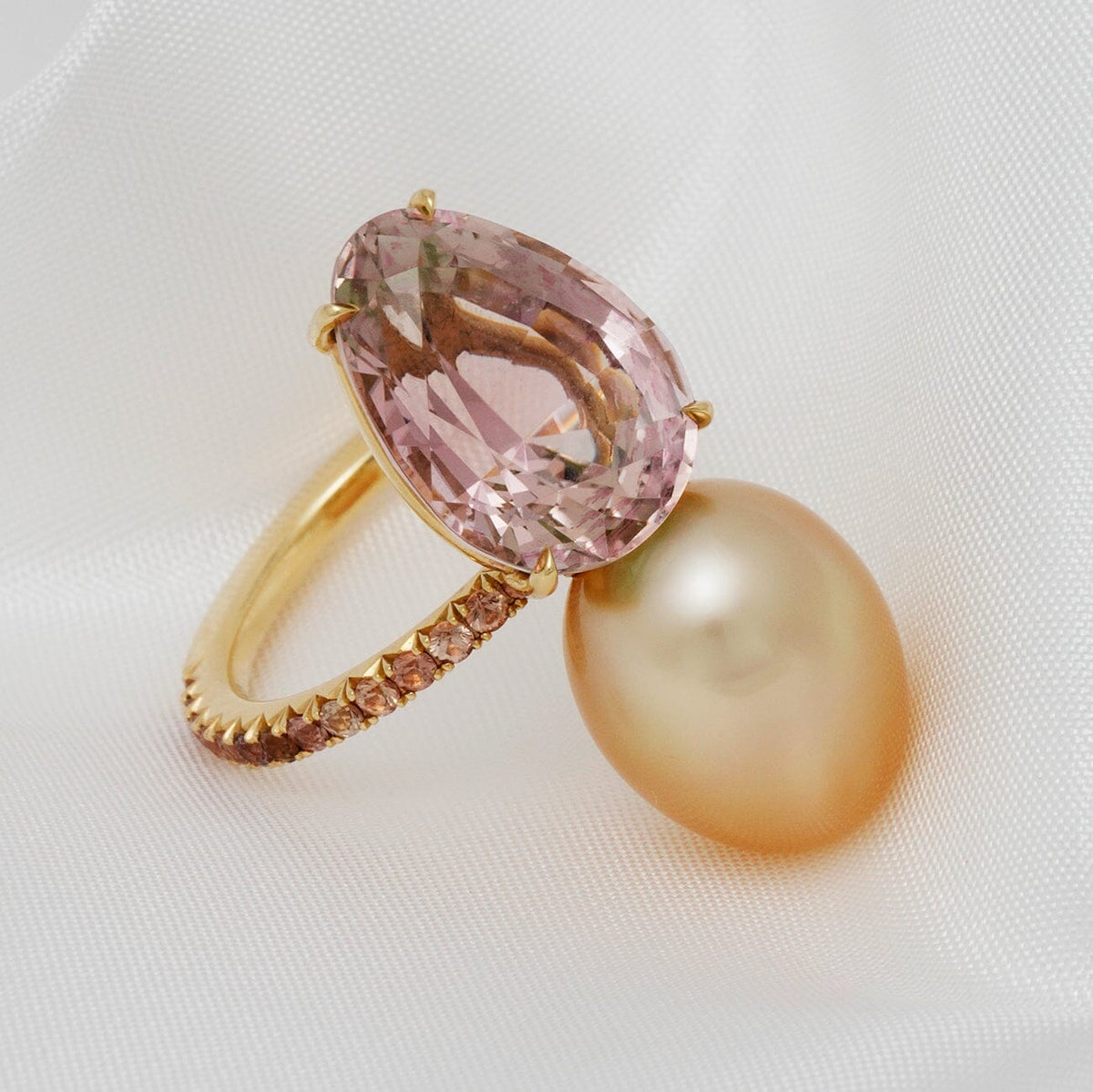Assael Collection: 10.9x14.2 mm Golden South Sea Pearl, Tourmaline & Yellow Sapphire Ring featuring a large golden pearl and pear-shaped pink tourmaline set in a gold band with yellow sapphires.