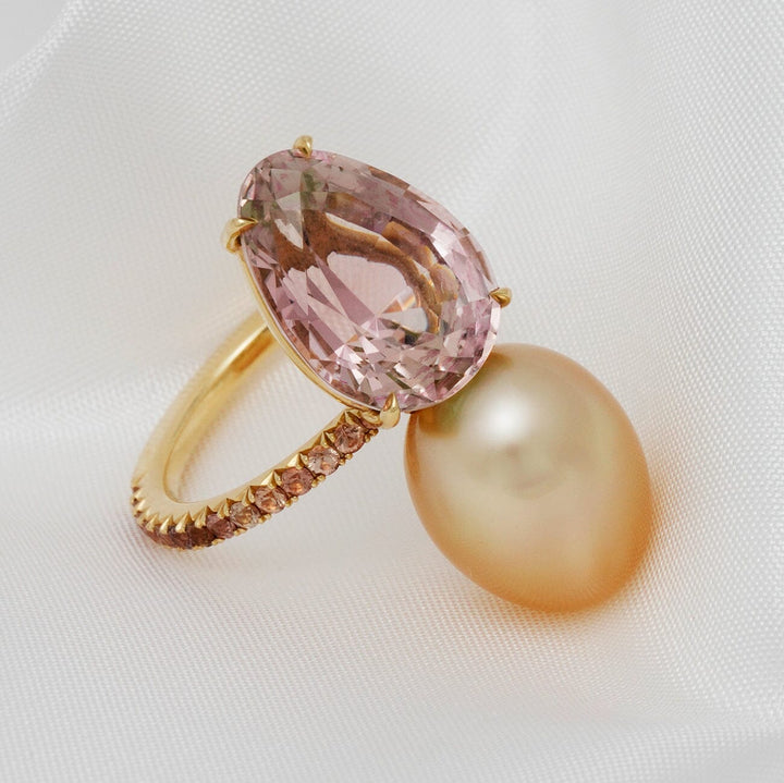 Assael Collection: 10.9x14.2 mm Golden South Sea Pearl, Tourmaline & Yellow Sapphire Ring featuring a large golden pearl and pear-shaped pink tourmaline set in a gold band with yellow sapphires.