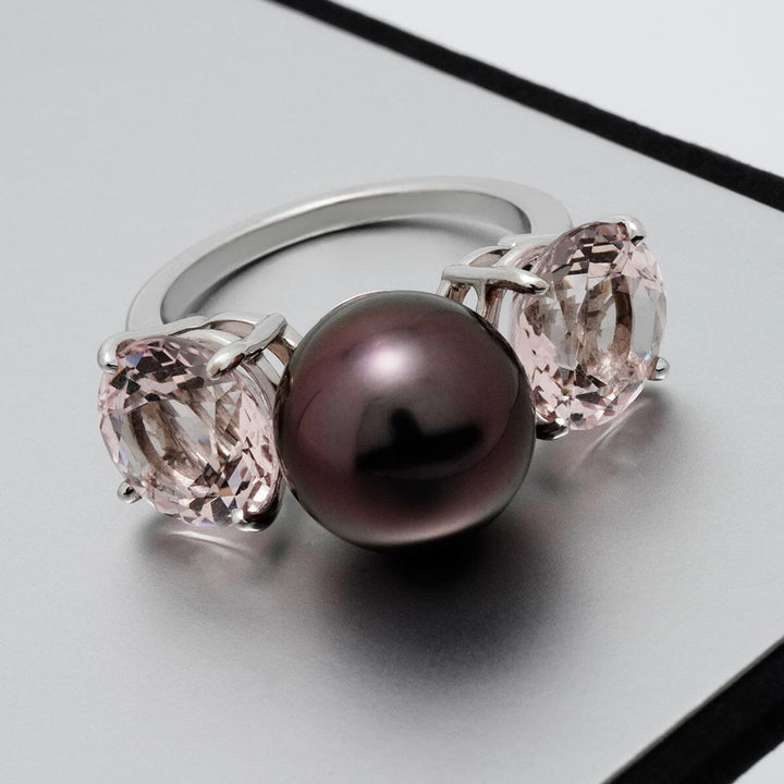 Assael Collection: 11.2 mm Tahitian Pearl and Morganite Ring featuring a large dark Tahitian pearl flanked by two light pink Morganite gemstones set in a polished silver band.