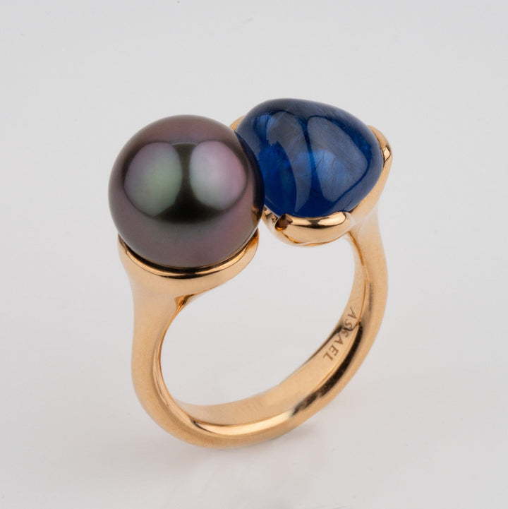 Assael Collection: 10.0 mm Tahitian Pearl and Burmese Sapphire Ring featuring a lustrous dark Tahitian pearl and a deep blue Burmese sapphire set on a polished gold band.