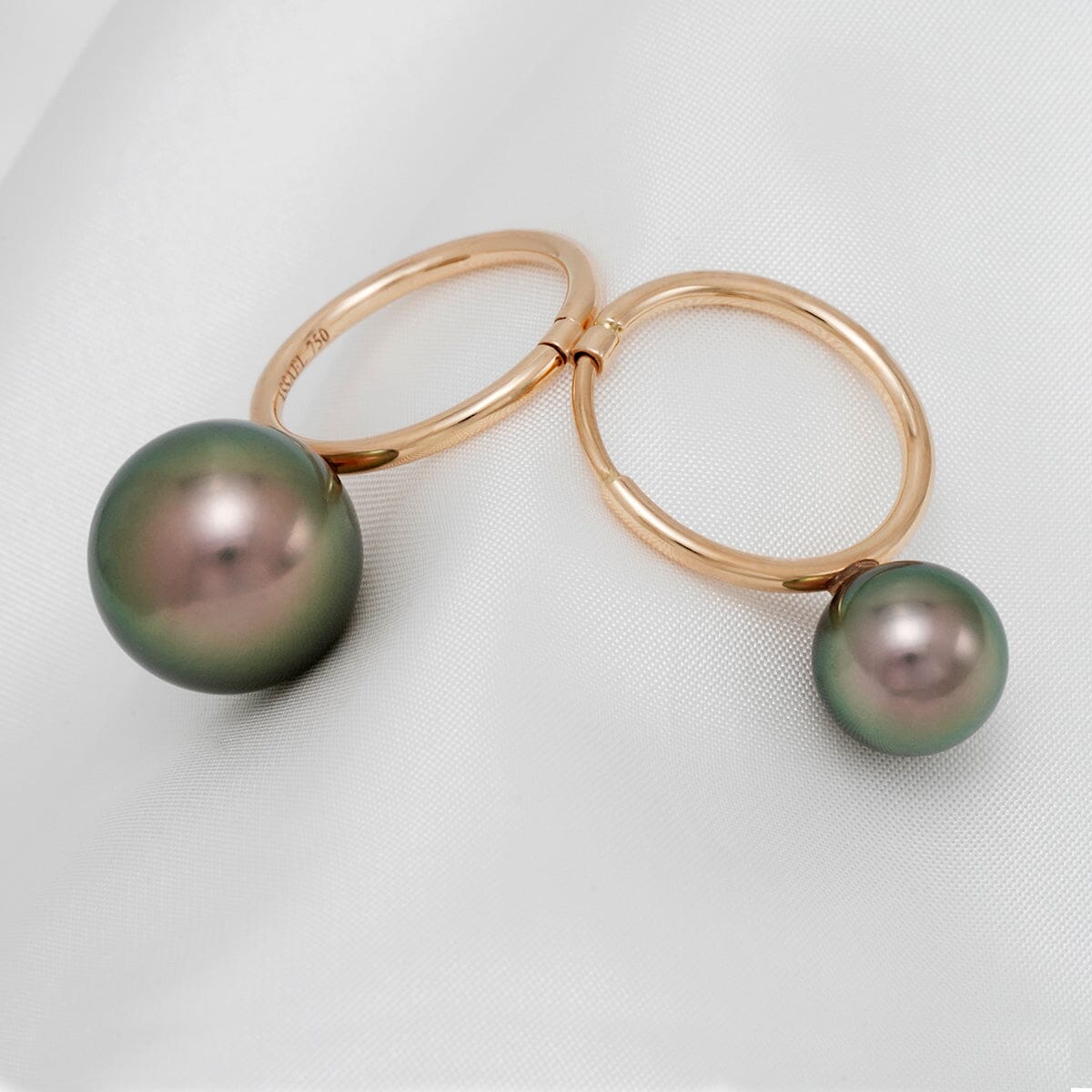 Assael Collection: 10.1 and 14.2 mm Tahitian Pearl Ring featuring two lustrous black and green pearls set on elegant polished gold bands.