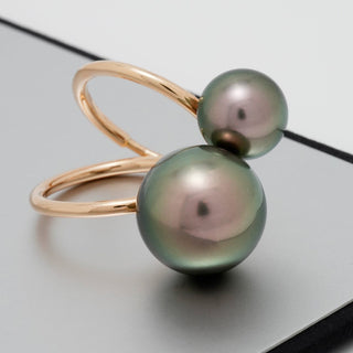 Elegant gold ring featuring two lustrous Tahitian pearls, one larger and one smaller, showcasing the Assael Collection: 10.1 and 14.2 mm Tahitian Pearl Ring design.