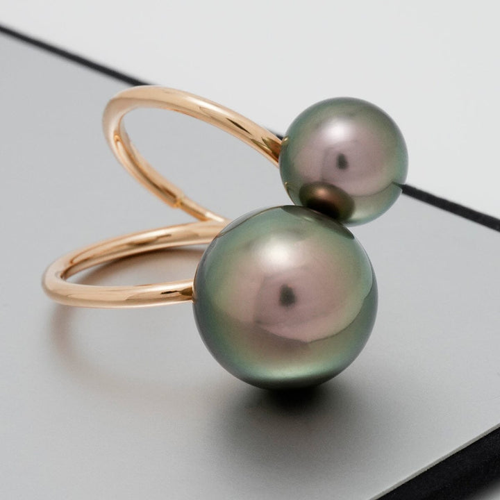 Elegant gold ring featuring two lustrous Tahitian pearls, one larger and one smaller, showcasing the Assael Collection: 10.1 and 14.2 mm Tahitian Pearl Ring design.