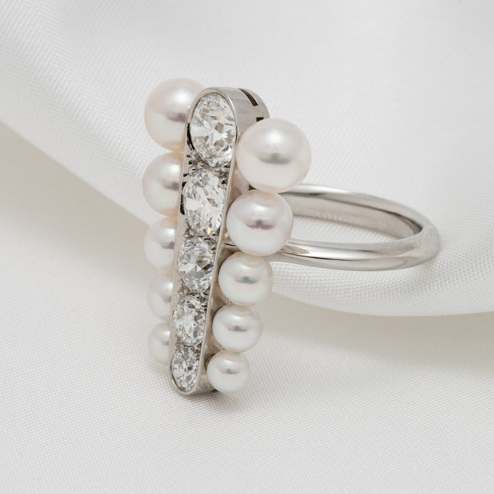 Assael Collection: 3.5–5.9 mm Akoya Pearl and Diamond Ring featuring lustrous white akoya pearls encircling a sleek band set with sparkling round-cut diamonds on a polished silver ring band.