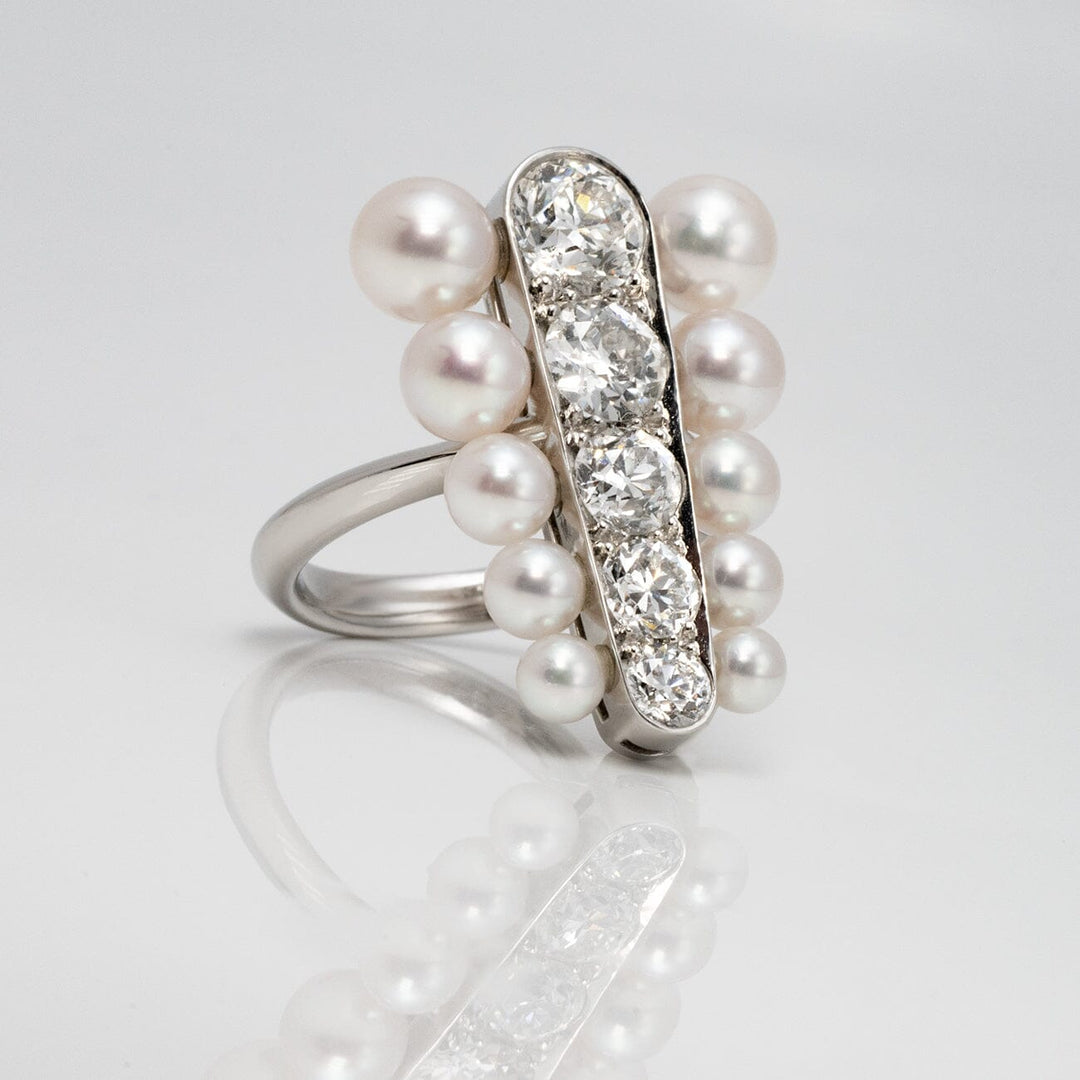 Assael Collection: 3.5–5.9 mm Akoya Pearl and Diamond Ring featuring lustrous akoya pearls surrounding a vertical row of sparkling diamonds set in polished metal.