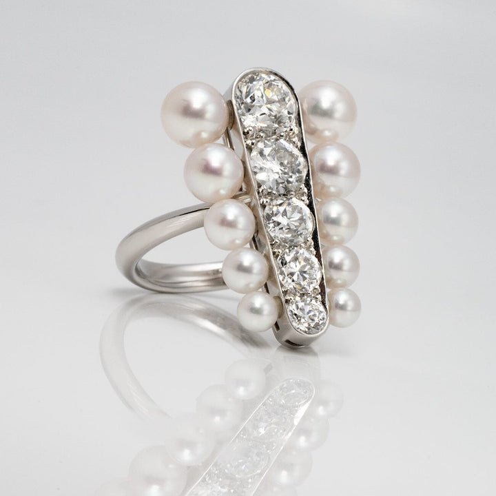 Assael Collection: 3.5–5.9 mm Akoya Pearl and Diamond Ring featuring lustrous akoya pearls surrounding a vertical row of sparkling diamonds set in polished metal.