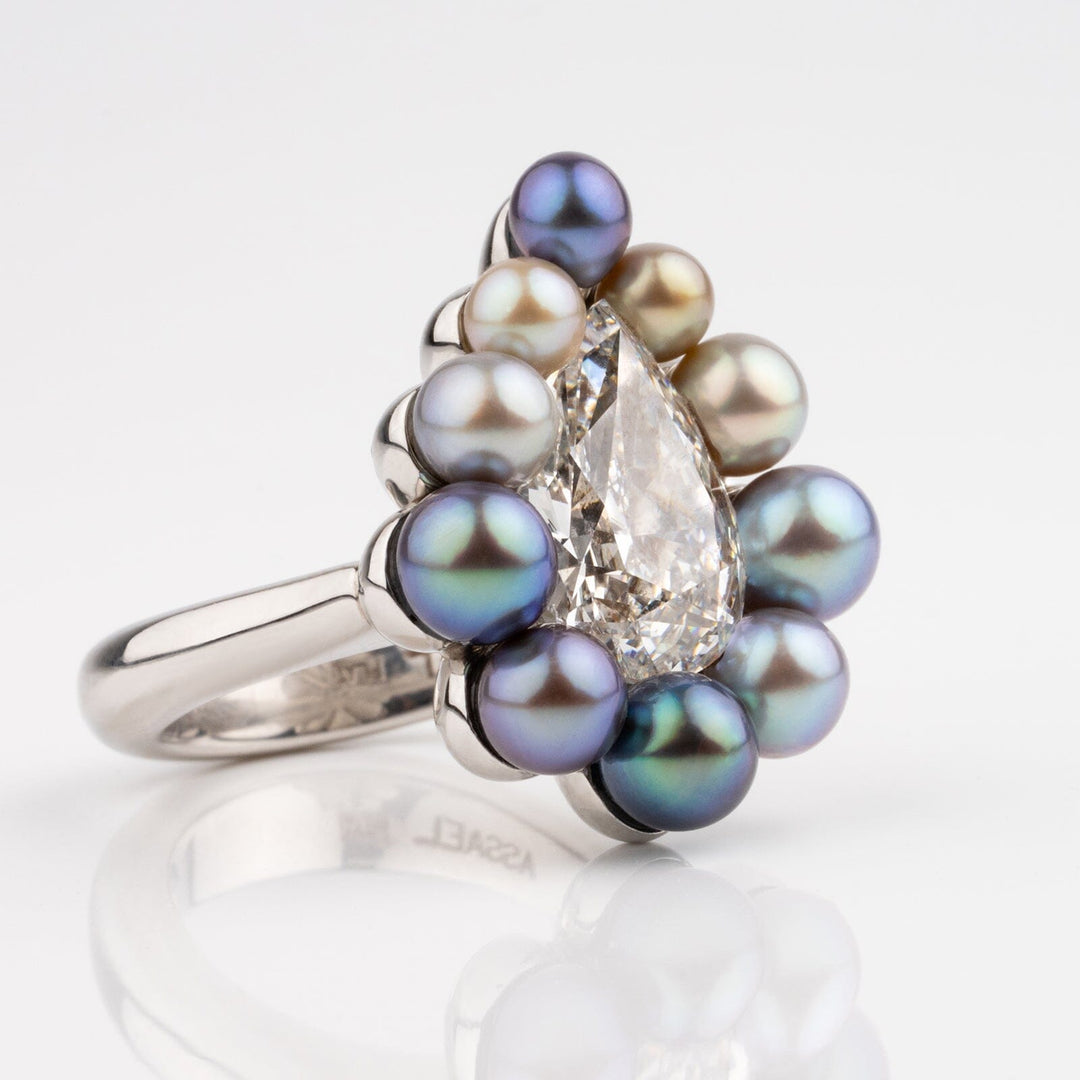 Assael Collection: 10.95 Carat Natural Pearl and 5.05 Carat Natural Diamond Platinum Ring featuring a pear-shaped diamond surrounded by multicolored natural pearls on a platinum band.