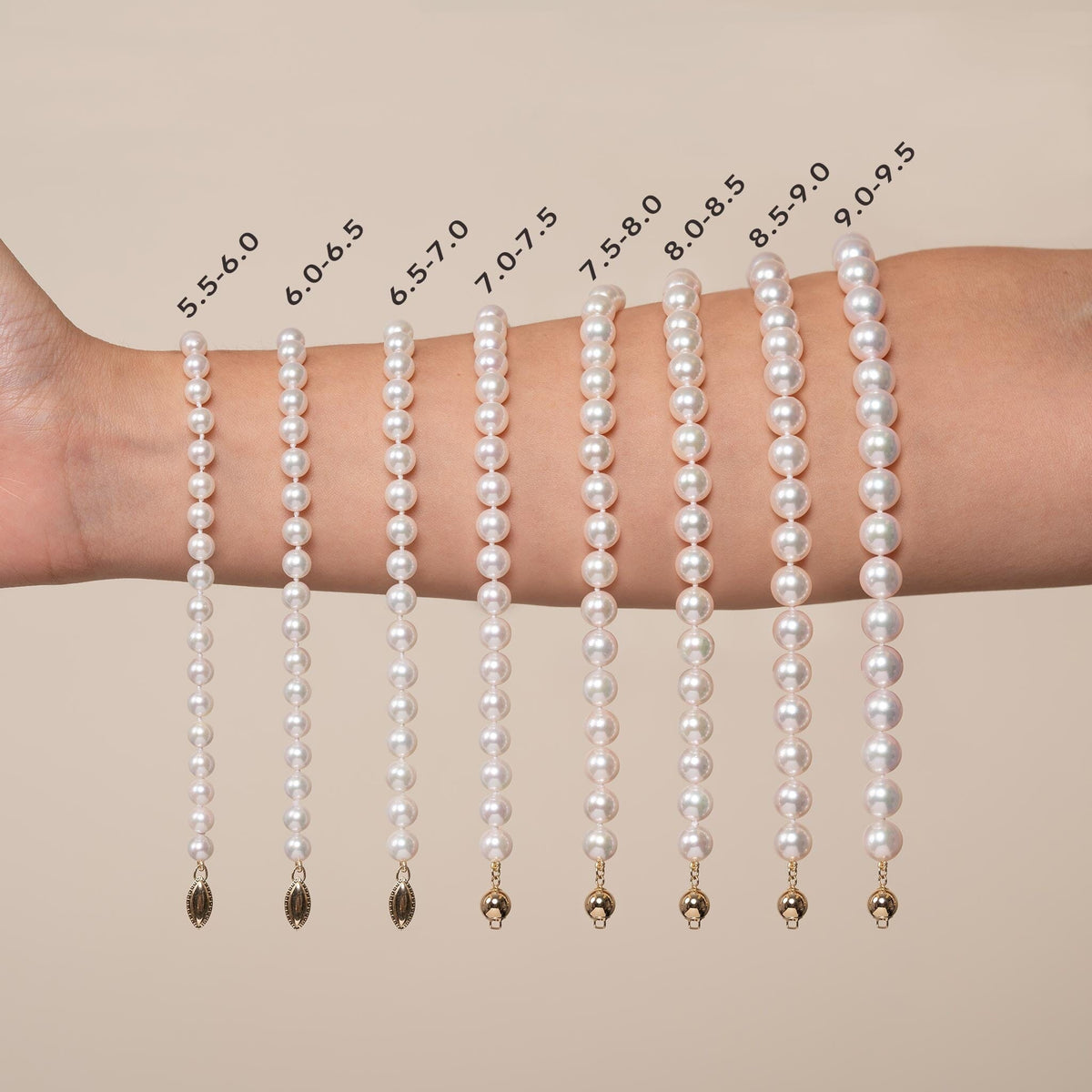 Various sizes of 6.5-7.0 mm White Akoya AAA Pearl Bracelet strands displayed on a wrist for size comparison, showcasing cultured white pearls in graduated measurements.
