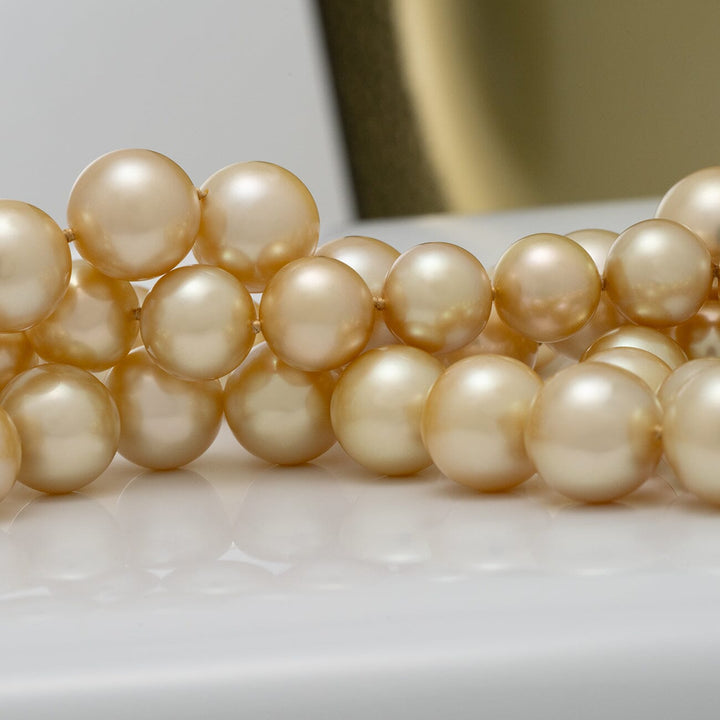 10.5–14.0 mm round golden South Sea endless pearl strand
