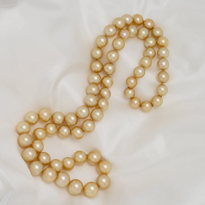 10.5–14.0 mm round golden South Sea endless pearl strand