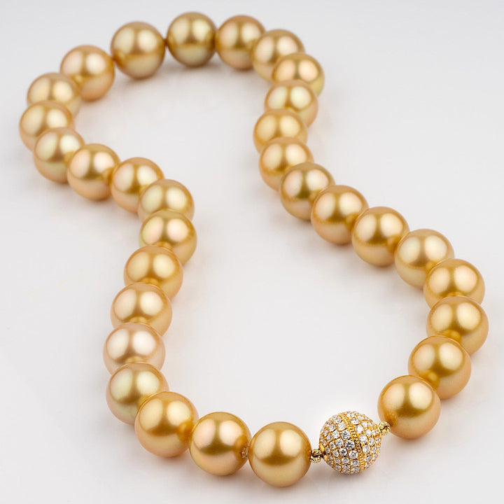 Exceptional Golden South Sea pearl necklace, 31 round pearls 11.5–15.0 mm. Superb luster, natural golden color, one-of-a-kind, 18k YG diamond clasp.