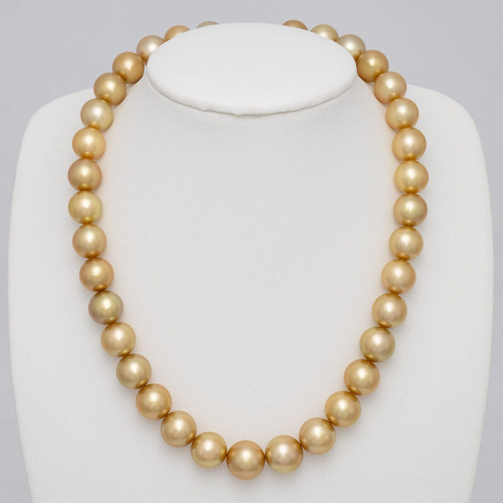 11.0–12.6 mm round golden South Sea pearl necklace on bust
