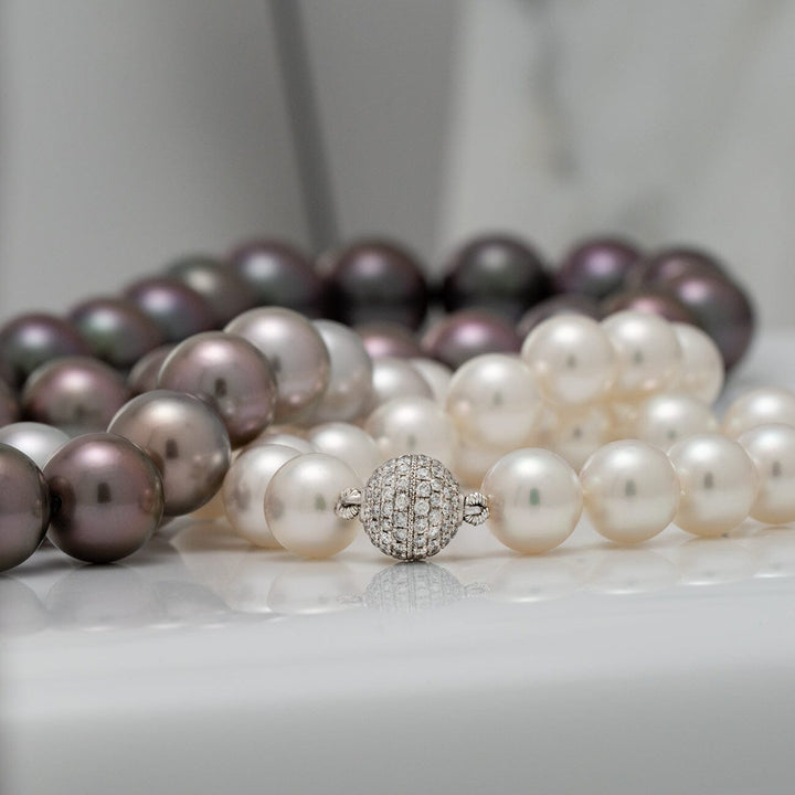 77 round pearls · 38.5 momme · approx. 35 inches · 18K white gold and diamond clasp · 112 diamonds, 0.80 cttw