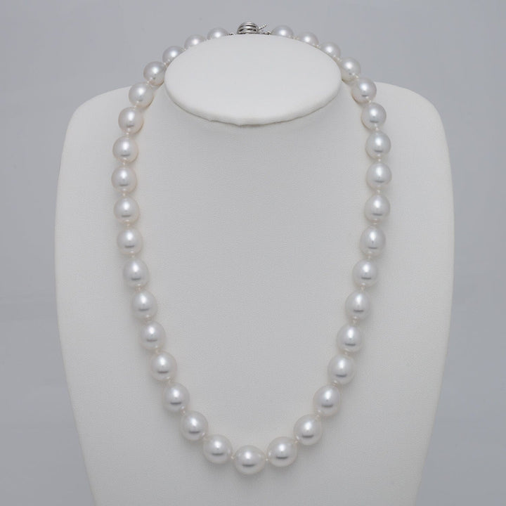 Oval South Sea pearl necklace featuring 35 luminous pearls with refined white luster, finished with an 18K white gold clasp. On Bust