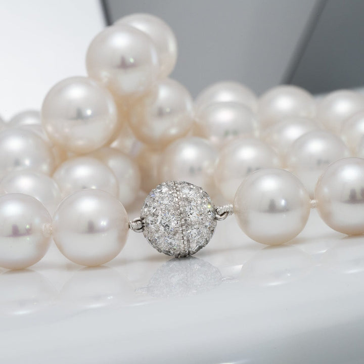 South Sea pearl necklace, 62 round pearls 12.0–14.0 mm, 49.9 momme. Superb luster, natural color-Clasp close up.