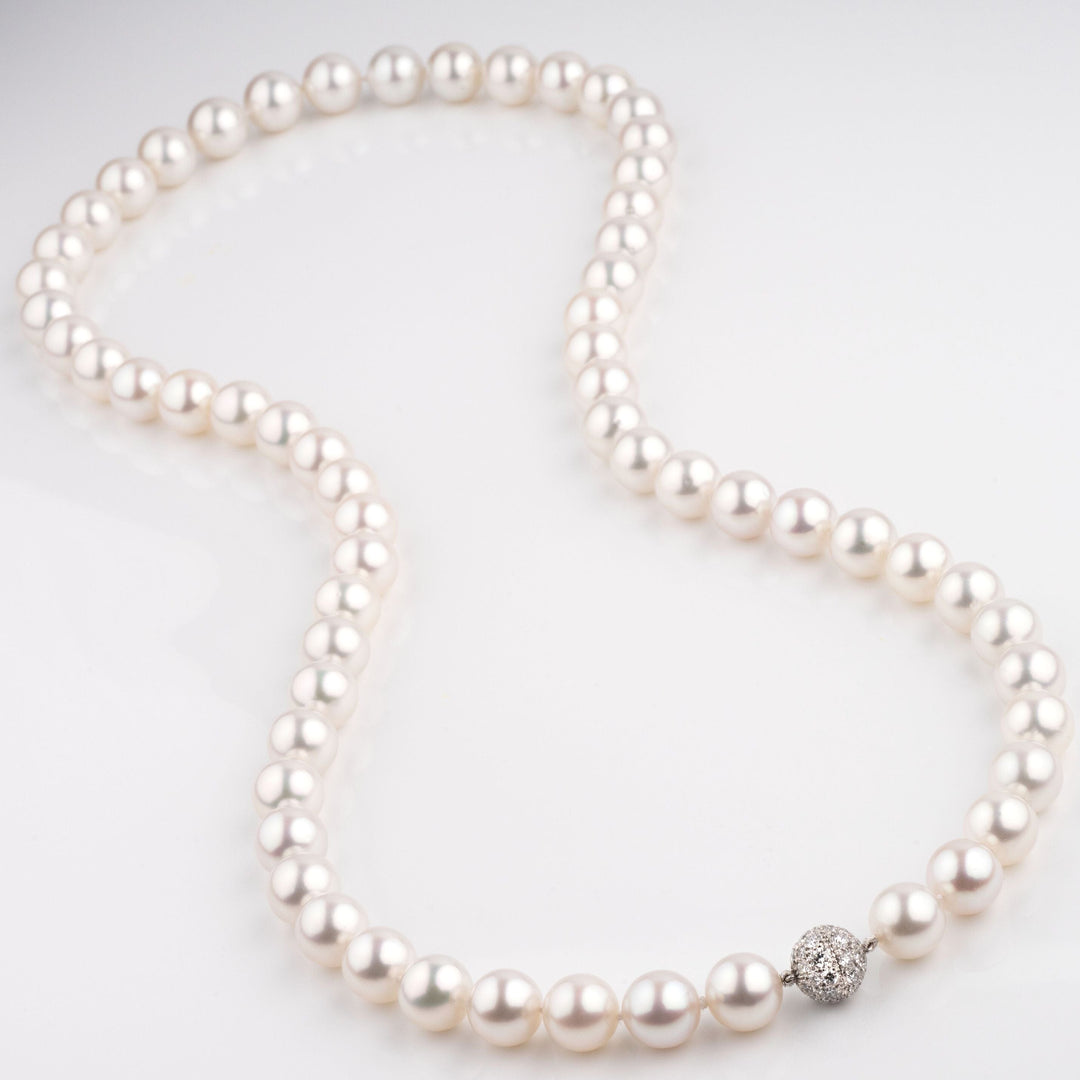 South Sea pearl necklace, 62 round pearls 12.0–14.0 mm, 49.9 momme.  platinum/18k diamond clasp.