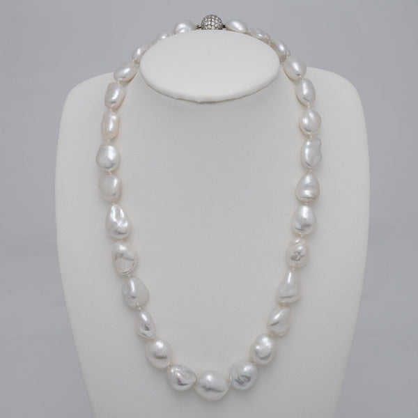 11.2–15.3 mm White South Sea keshi pearl necklace featuring 29 pearls and an 18K white gold diamond clasp with 106 diamonds totaling 2.39 carats.
