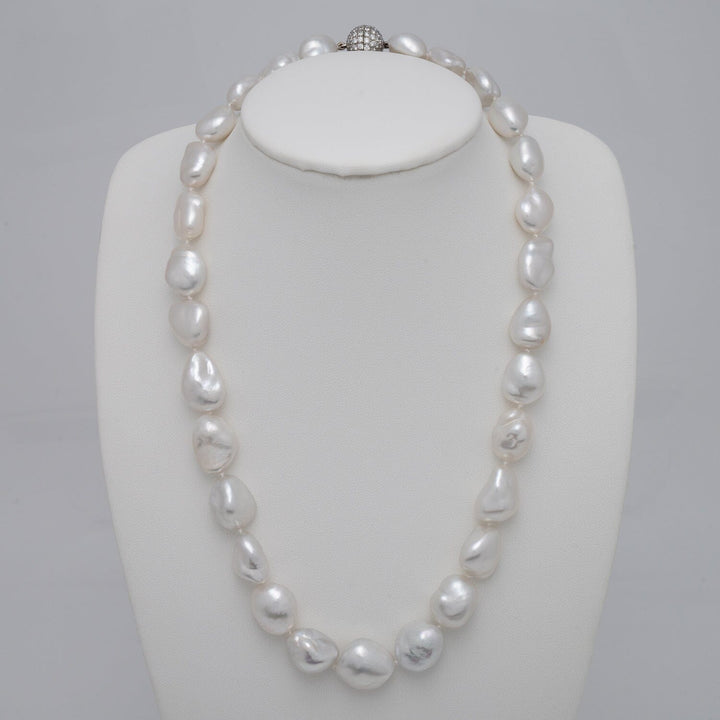 11.2–15.3 mm White South Sea keshi pearl necklace featuring 29 pearls and an 18K white gold diamond clasp with 106 diamonds totaling 2.39 carats.