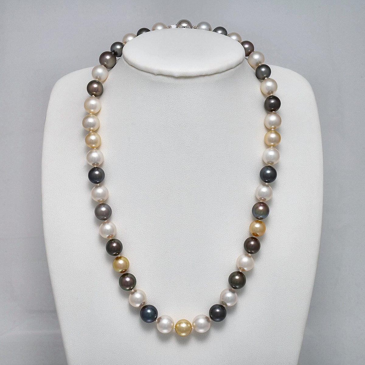 9.1-10.8 mm Round Multicolor South Sea and Tahitian Pearl Necklace on a dark background