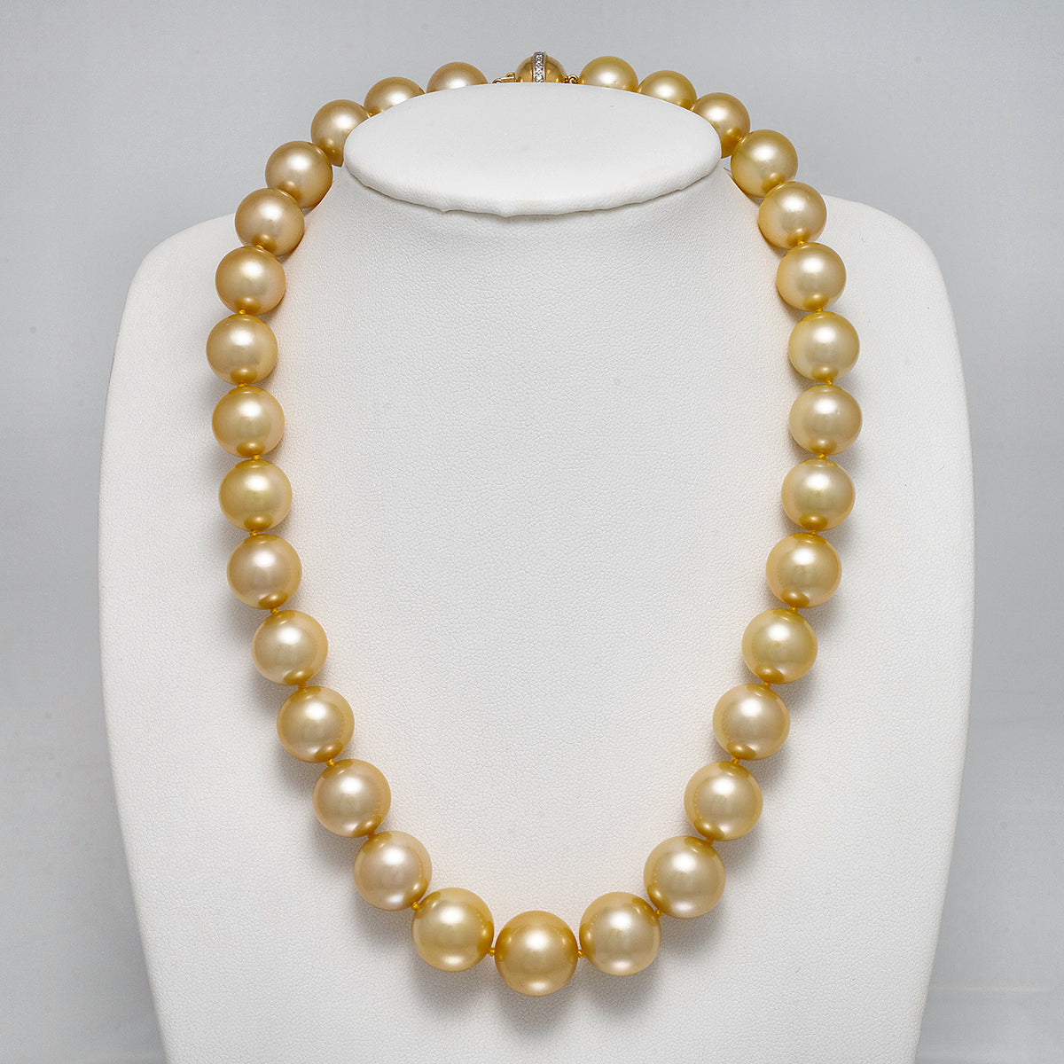 12.0-14.8 mm AAA Round Golden South Sea Pearl Necklace on a dark background