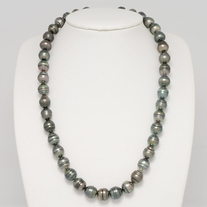The pearls exhibit tight circling, which lends to the colorful combinations you see in the individual pearls. They exhibit green, peacock, hints of blue and more.