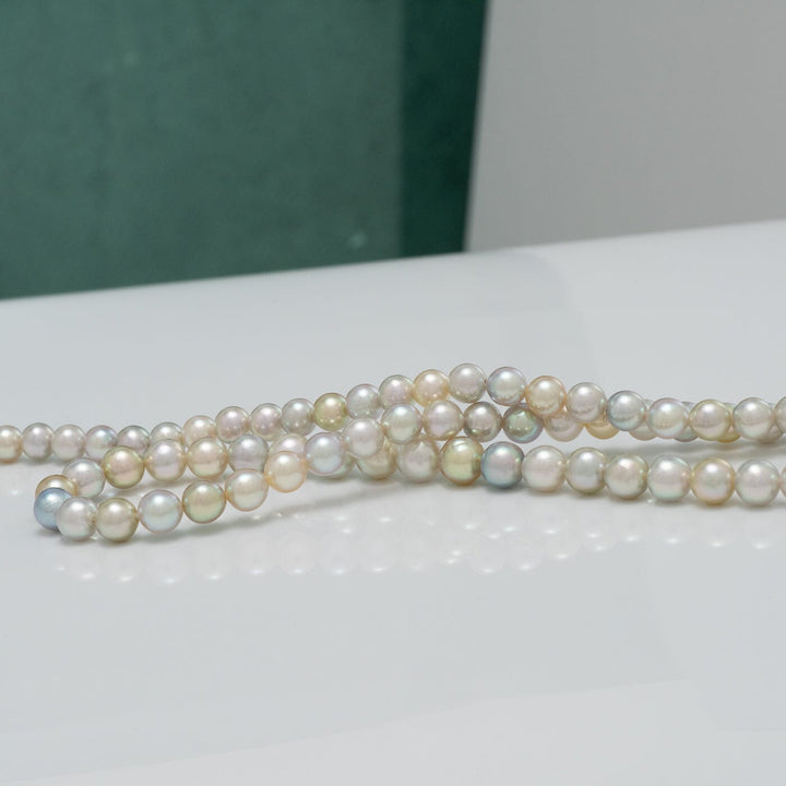TF-25: 4-5 mm Natural Multicolor Akoya Pearl Round Strands displaying lustrous pearls in soft shades of white, pink, lavender, and light green, perfect for elegant pearl jewelry.