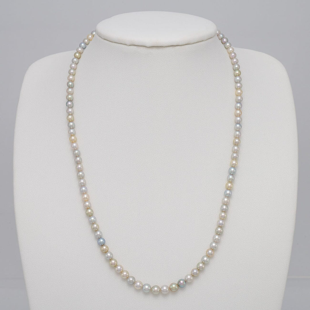 TF-25: 4-5 mm Natural Multicolor Akoya Pearl Round Strands necklace displayed on a white bust form, featuring lustrous round pearls in soft natural multicolor shades.