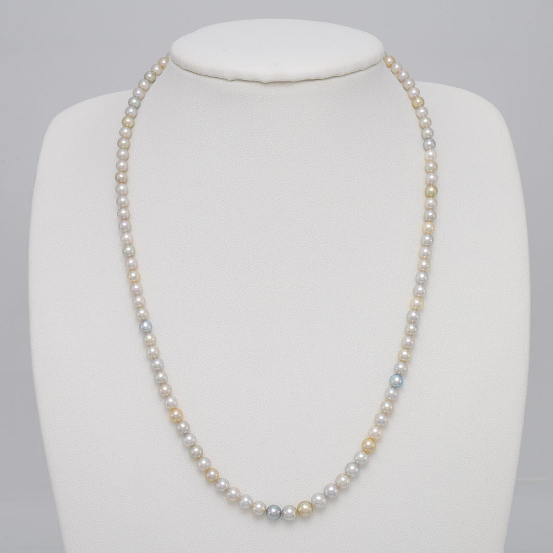TF-26: 4-5 mm Natural Multicolor Akoya Pearl Round Strands necklace displayed on a white bust, featuring natural cultured pearls in soft white, gold, and blue hues.