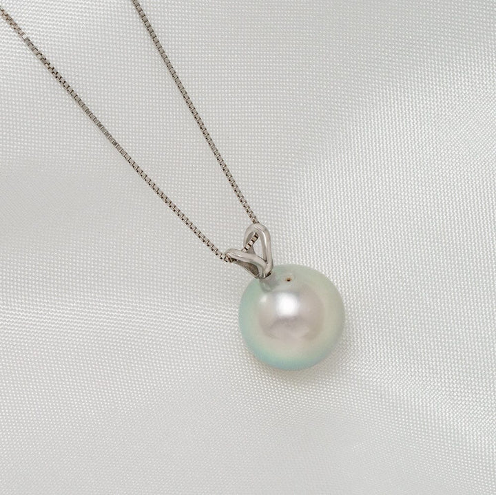 TK4-B: 10-10.5 mm Special Color Akoya Drop Pearl Unity Pendant featuring a lustrous round pearl with subtle iridescent hues on a delicate silver chain, perfect for elegant wear.