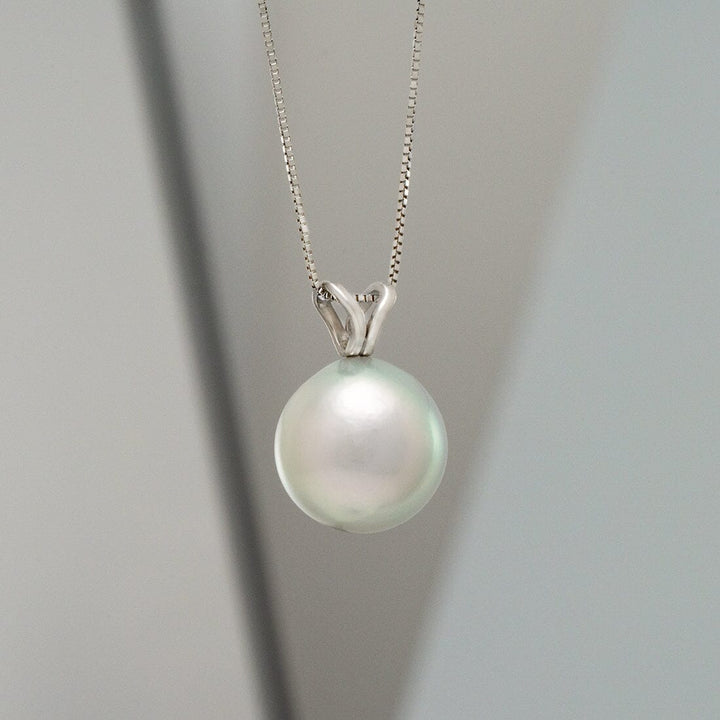 Elegant special color Akoya drop pearl pendant on a delicate silver chain, showcasing the TK4-B: 10-10.5 mm Special Color Akoya Drop Pearl Unity Pendant with a lustrous finish.