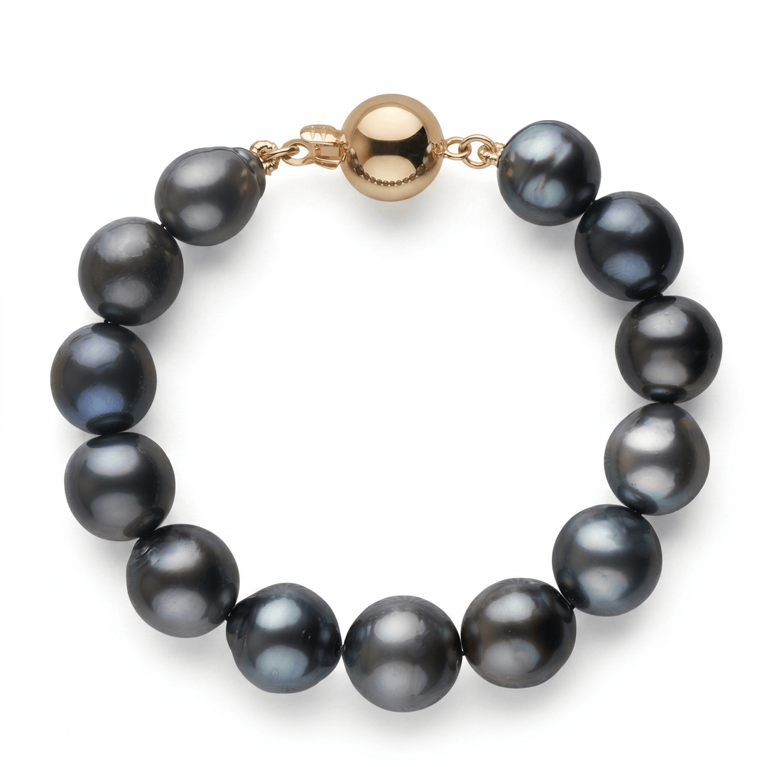 11.2-13.5 mm AA Tahitian Drop Pearl Bracelet featuring lustrous dark pearls with a gold clasp, showcasing natural variations in color and drop shapes for an elegant look.