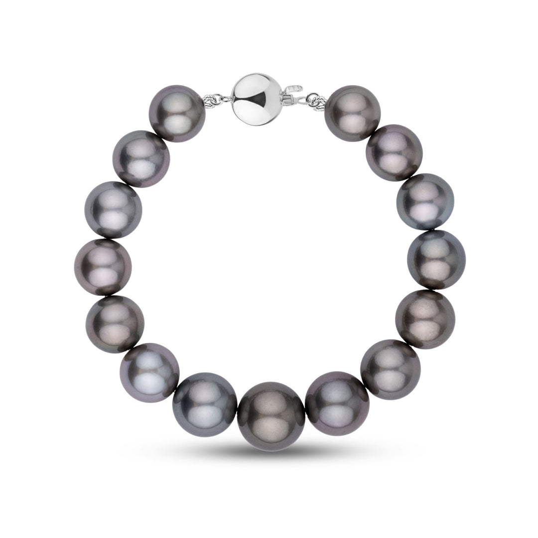 This bracelet features round AA+/AAA Tahitian pearls measuring 11.0–13.3 mm. The pearls display a dark gunmetal gray body color with smooth surfaces and sharp, reflective luster - white gold ball clasp