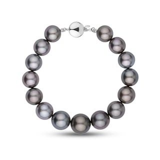 This bracelet features round AA+/AAA Tahitian pearls measuring 11.0–13.3 mm. The pearls display a dark gunmetal gray body color with smooth surfaces and sharp, reflective luster – white gold ball clasp