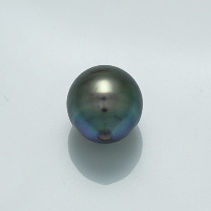 Single lustrous 11.4 x 10.5 mm Fijian Drop Pearl with deep dark hues and subtle iridescent overtones, showcasing the elegant natural beauty of cultured pearls.