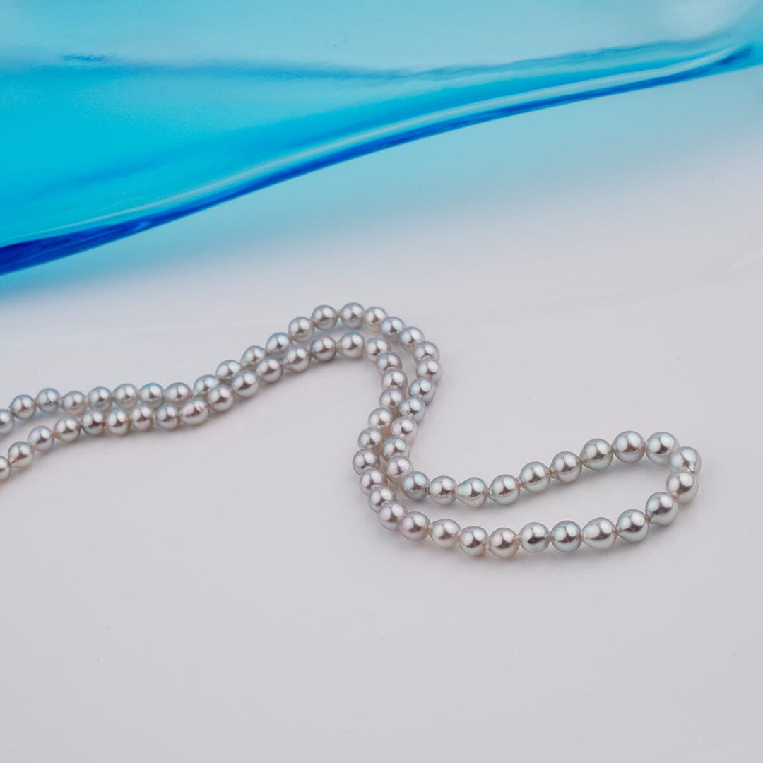 B-12: 3-4.5 mm Silver-blue Drop Akoya Strands, 16-inch Unfinished Strand featuring lustrous Akoya pearls with a delicate silver-blue hue, ideal for creating fine pearl necklaces or jewelry.