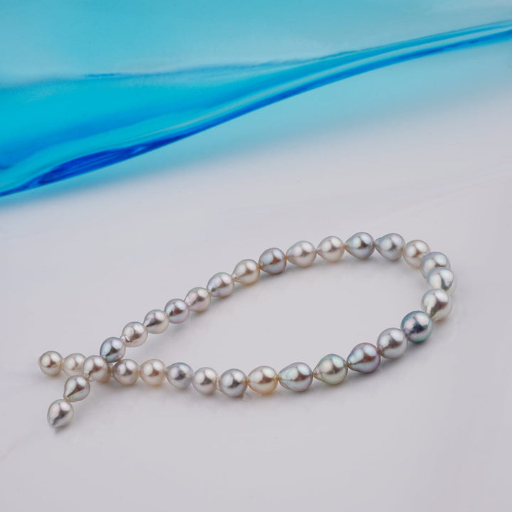 B-18: 4.5-6 mm Multicolor Drop Akoya Pearl Bracelets, 7.25" Unstrung featuring a delicate strand of multicolor akoya pearls in drop shapes, highlighting their natural luster and varied hues.