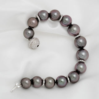 Assael Collection: 10.9–13.1 mm Tahitian Pearl and Diamond Bracelet featuring large, lustrous black pearls accented by sparkling diamond spacers and a pavé diamond clasp.