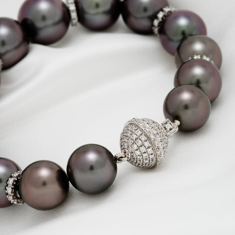 Assael Collection: 10.9–13.1 mm Tahitian Pearl and Diamond Bracelet featuring lustrous dark Tahitian pearls with a sparkling diamond-encrusted clasp on a white background.