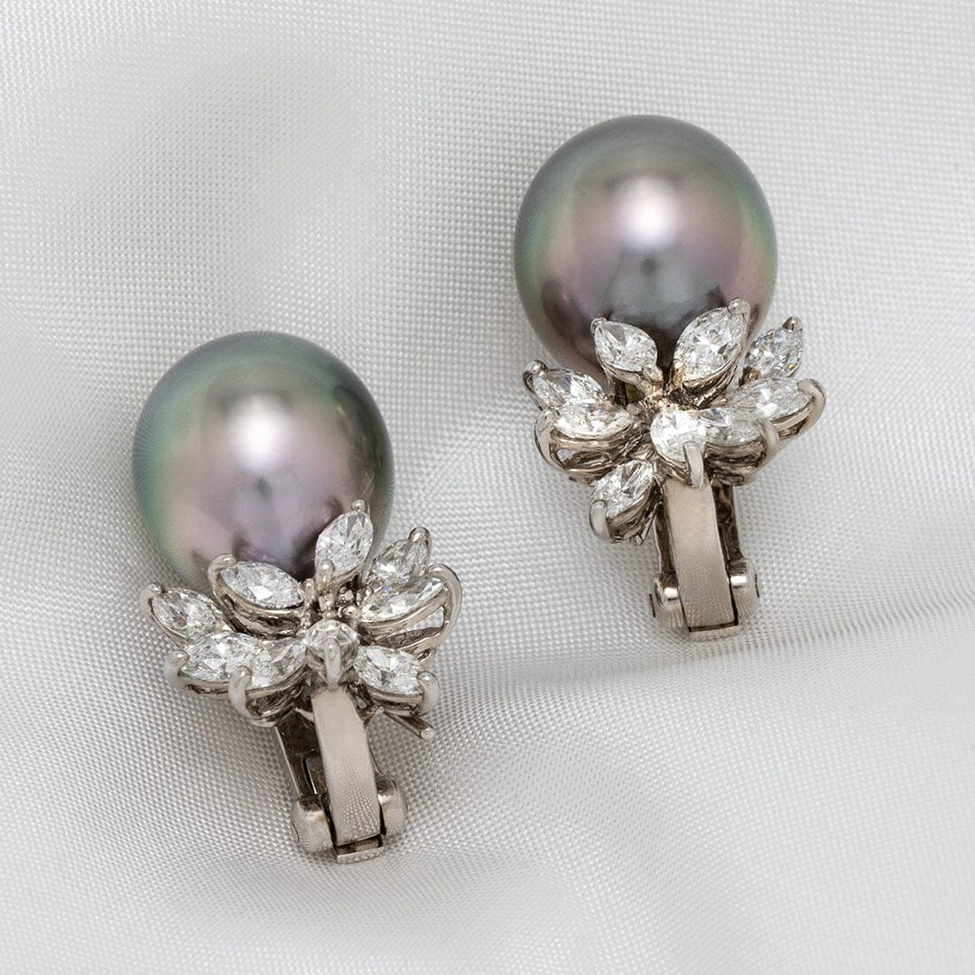 Assael Collection: 12.7–15.1 mm Tahitian Pearl and Diamond Earrings featuring lustrous black Tahitian pearls accented by sparkling marquise-cut diamonds on a white metal setting.