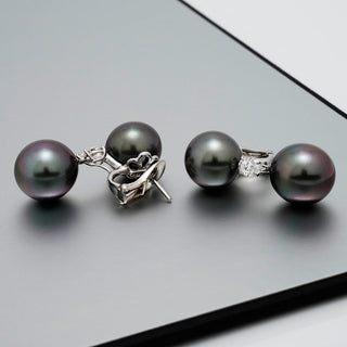 Assael Collection: 12.0–13.0 mm and 13.0–13.0 mm Tahitian Pearl and Diamond Earrings featuring lustrous dark Tahitian pearls accented with sparkling diamonds on elegant platinum settings.