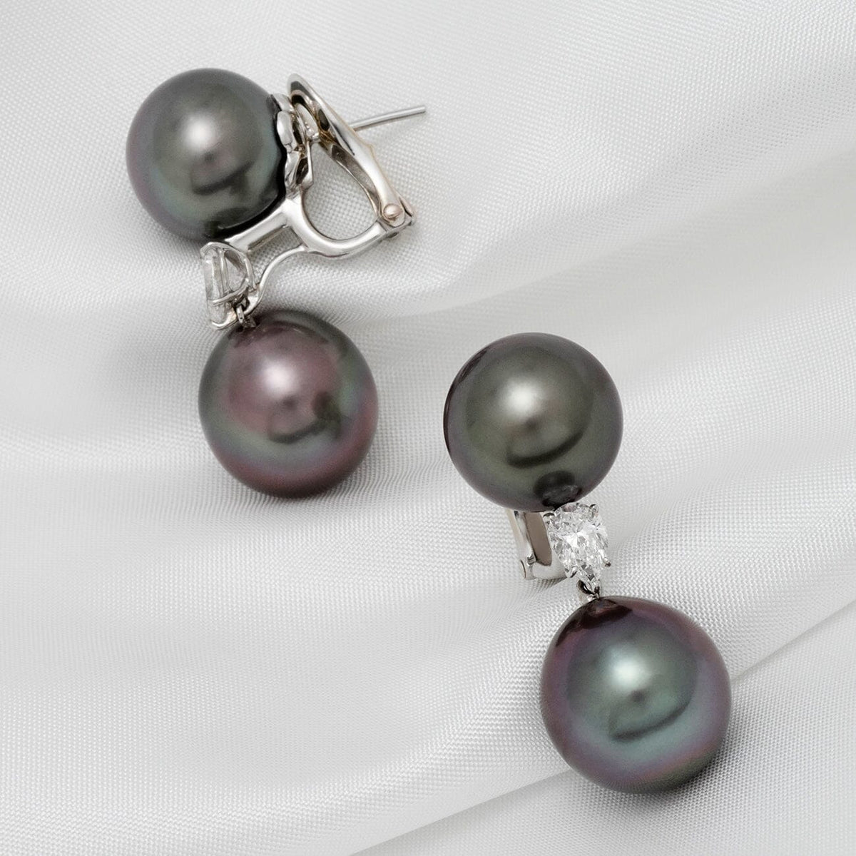 Assael Collection: 12.0–13.0 mm and 13.0–13.0 mm Tahitian Pearl and Diamond Earrings featuring lustrous dark Tahitian pearls and sparkling diamonds set in elegant metal clasps.