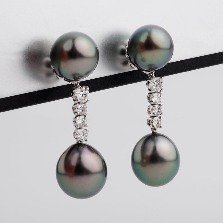 Assael Collection: 10.4–11.2 mm Tahitian Pearl and Diamond Earrings featuring lustrous black Tahitian pearls with a vertical row of sparkling diamonds set in elegant white metal.