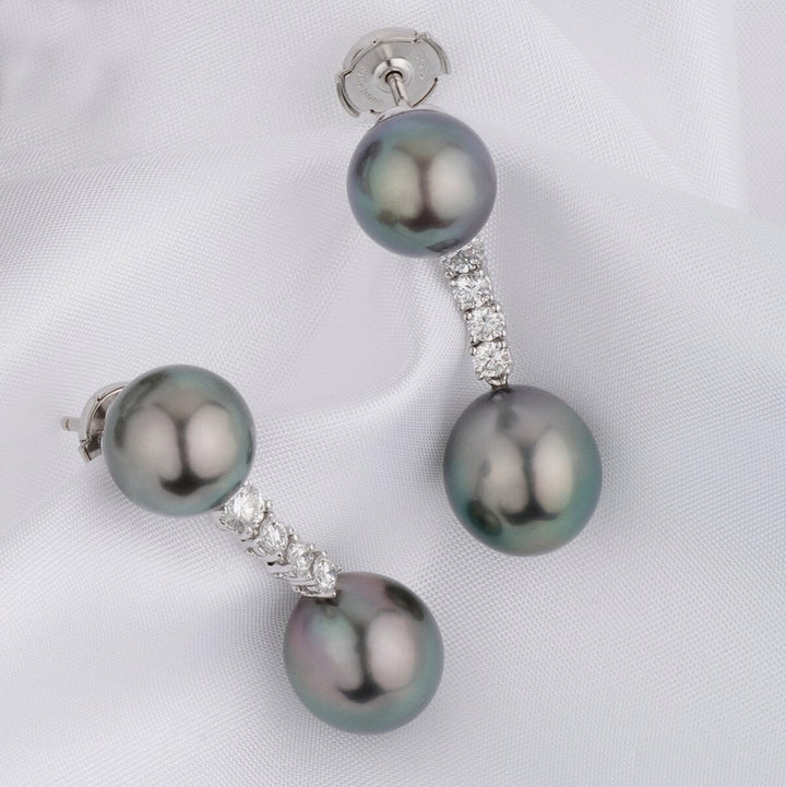 Assael Collection: 10.4–11.2 mm Tahitian Pearl and Diamond Earrings featuring lustrous black Tahitian pearls accented with a curve of sparkling diamonds on a silver setting.