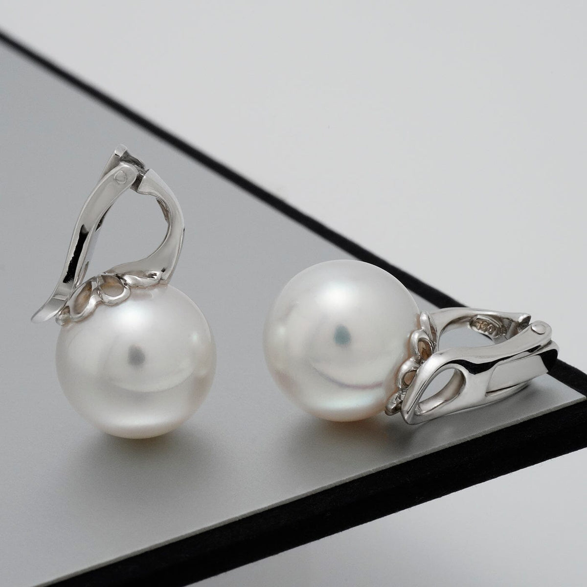 Assael Collection: 11.9 mm South Sea Pearl Earrings featuring lustrous white pearls set in elegant 14K white gold clasps, perfect for refined and classic pearl jewelry lovers.