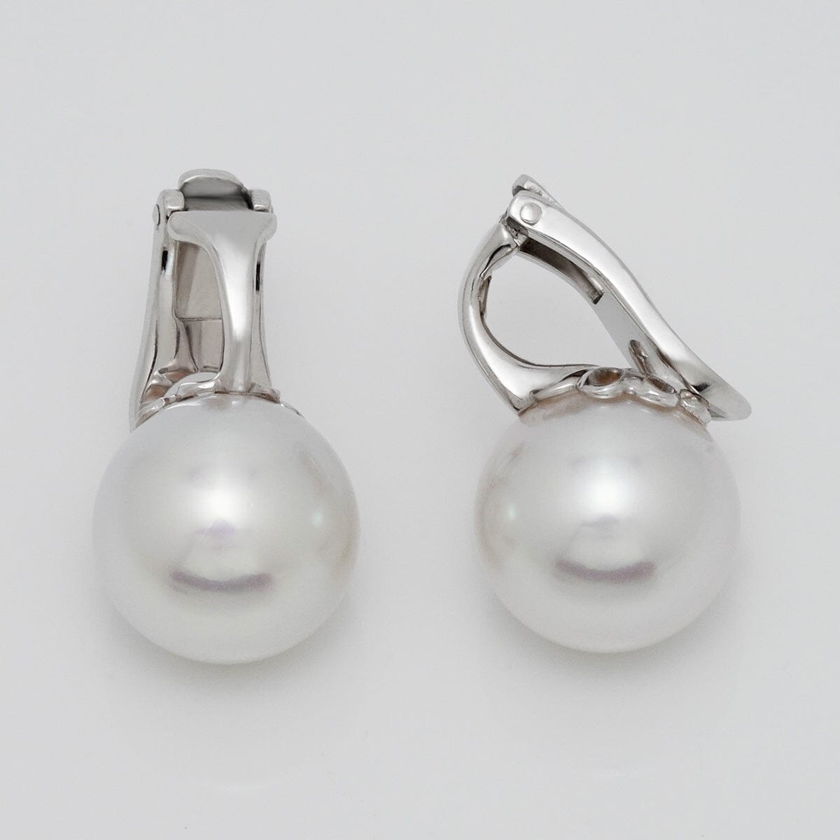 Assael Collection: 11.9 mm South Sea Pearl Earrings featuring lustrous white pearls set on elegant 14K white gold clasps, perfect for a timeless and sophisticated look.