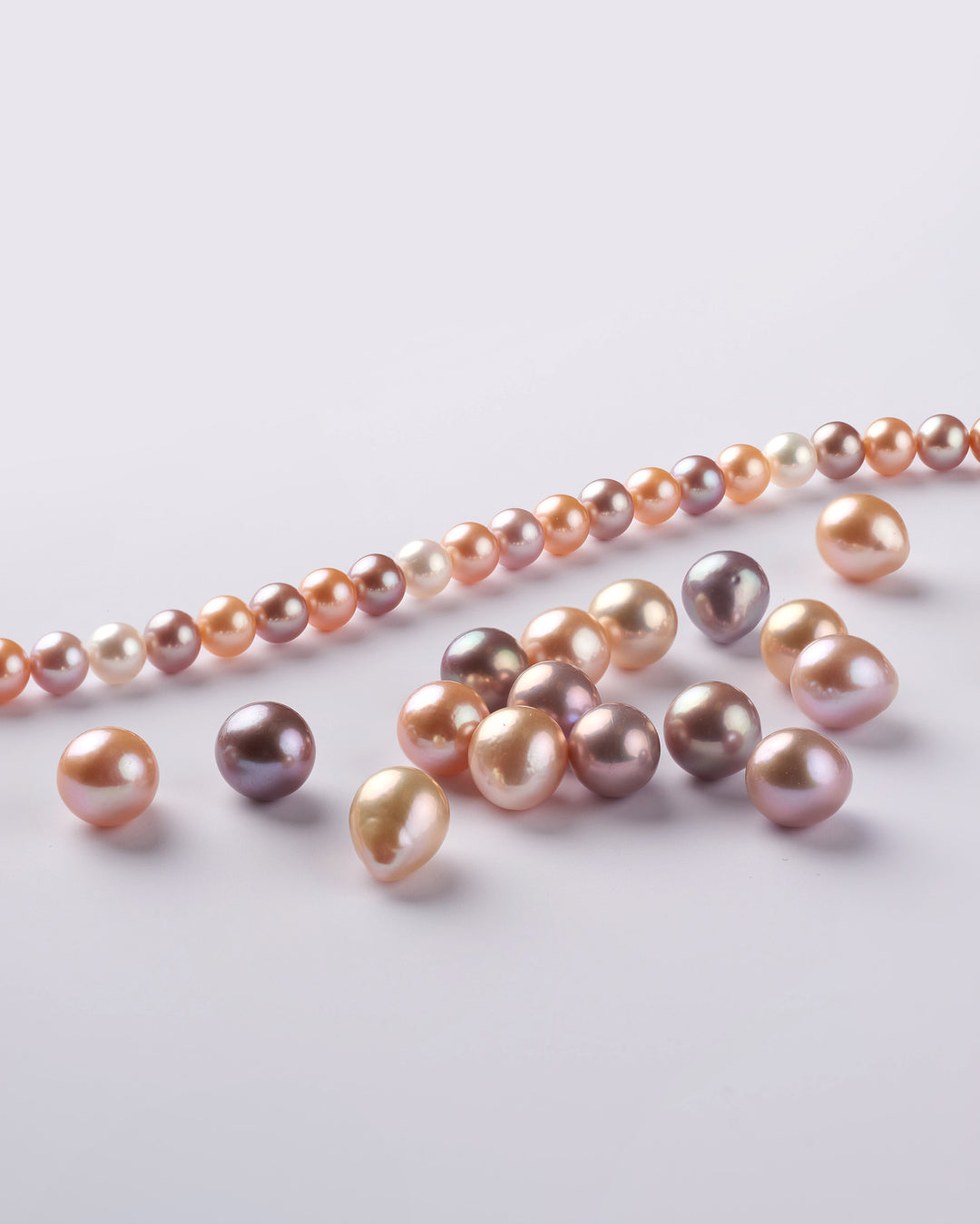 Dark, natural-color freshwater pearls in multicolored tones