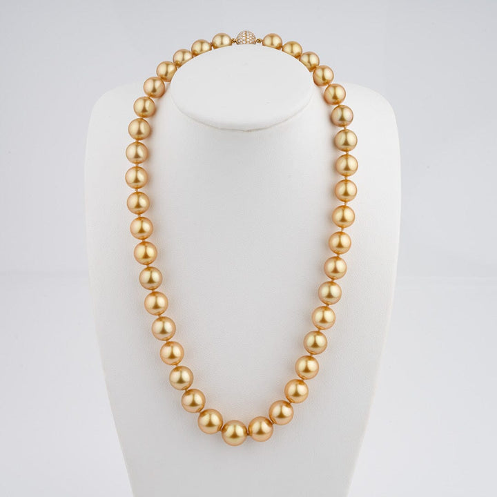 9.2–11.4 mm deep golden South Sea pearl and diamond necklace on bust
